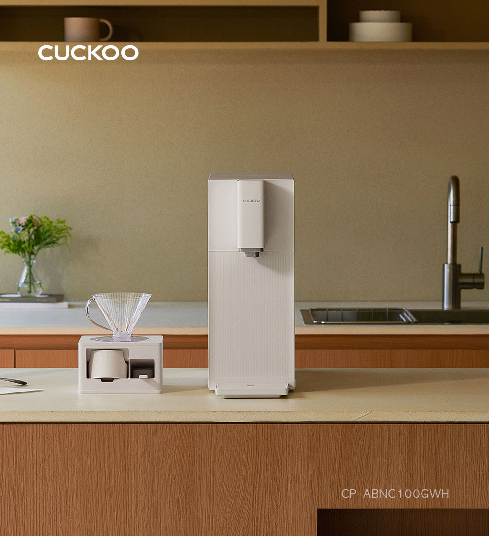 Steam 100 Barista water purifier on kitchen counter with coffee station, and text: Finally, a perfectly completed home café. (cp-abnc100)