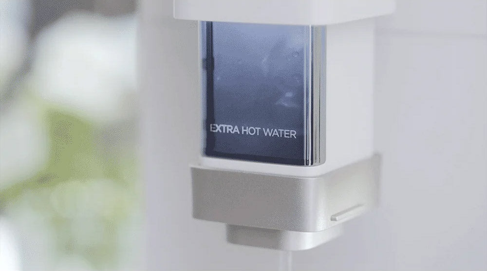 See-through dispenser showing 100 degree hot watter